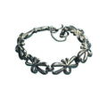 Vintage Monet Silver-Tone Bow Link Bracelet With Safety Chain 7-Inch Elegant Design