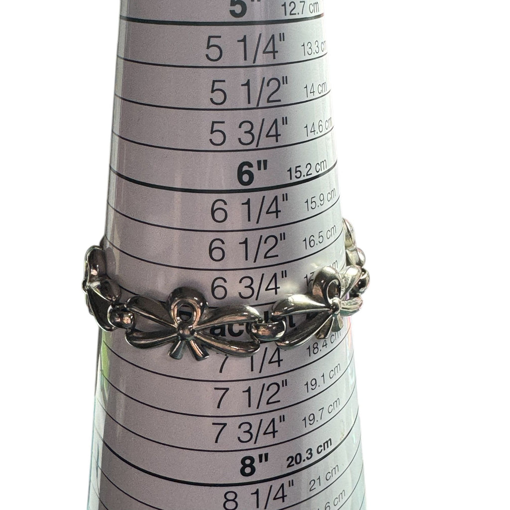 Vintage Monet Silver-Tone Bow Link Bracelet With Safety Chain 7-Inch Elegant Design